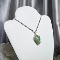 Green aventurine wire wrapped pendant in silver.