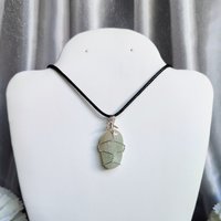 Green aventurine wire wrapped pendant in silver.