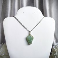 Green aventurine wire wrapped pendant in silver.