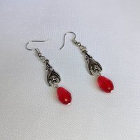 Gothic vampire bat earrings with red or black bead drops.
