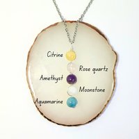 Depression pendant with citrine, rose quartz, amethyst, moonstone, aquamarine and chain or cord.