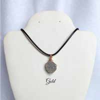 Raw celestite wrapped in gold, rose gold or copper wire with cord.