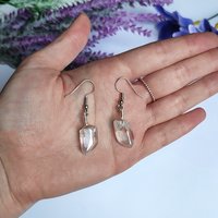 Wire wrapped titanium quartz crystal dangle earrings.