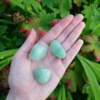 Green aventurine polished tumblestone.