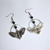 Silver death mask earrings with metal ring and black crystal beads.