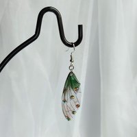 Fairy dangle earrings with clear and green resin fairy wings, glitter and diamantes. 
