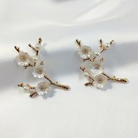 Gold branch charms with flowers and faux pearl beads.