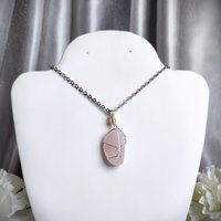 Rose quartz wire wrapped pendant in silver.