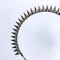 Studded headband with silver spikes wire wrapped onto a black headband.