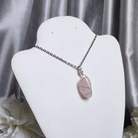 Rose quartz wire wrapped pendant in silver.