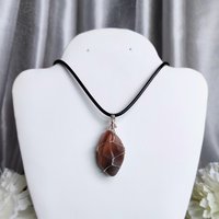 Moonstone wire wrapped pendant with chain or cord.