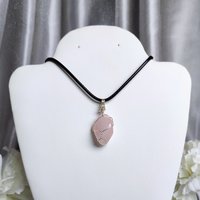 Rose quartz wire wrapped pendant in silver.