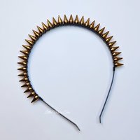 Studded headband with silver spikes wire wrapped onto a black headband.