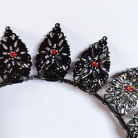 Halo crowns with filigree teardrops in silver, gold or black.