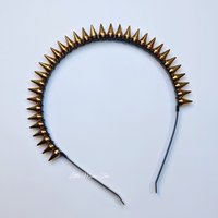 Studded headband with silver spikes wire wrapped onto a black headband.