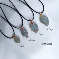 Raw celestite wrapped in gold, rose gold or copper wire with cord.