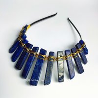 Cleopatra crystal crown with lapis lazuli wire wrapped onto a black headband.