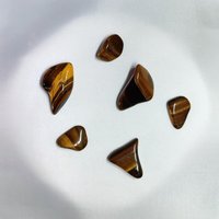 Tiger's eye wire wrapped pendant with chain or cord.