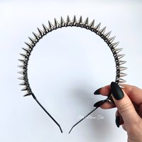 Studded headband with silver spikes wire wrapped onto a black headband.