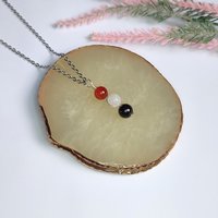 Gemstone pendant for love and relationships with carnelian, rose quartz and garnet beads.