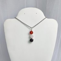 Gemstone pendant for love and relationships with carnelian, rose quartz and garnet beads.