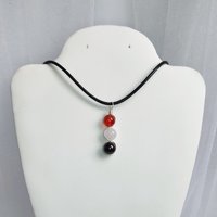 Gemstone pendant for love and relationships with carnelian, rose quartz and garnet beads.