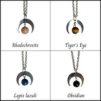 Silver moon pendant with gemstone beads.