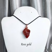 Carnelian tumblestone wrapped in gold, rose gold or copper wire.