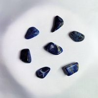 Sodalite wire wrapped pendant in silver.