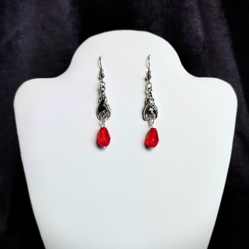 Gothic vampire bat earrings with red or black bead drops.
