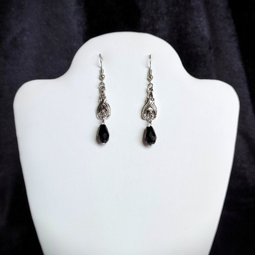 Gothic vampire bat earrings with red or black bead drops.