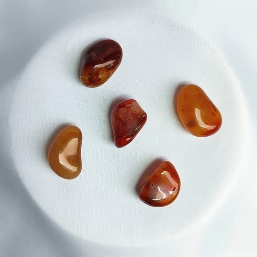 Carnelian tumblestone wrapped in gold, rose gold or copper wire.