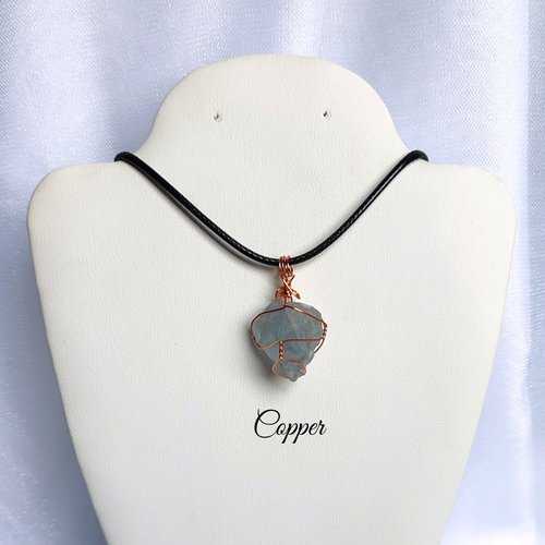 Raw celestite wrapped in gold, rose gold or copper wire with cord.