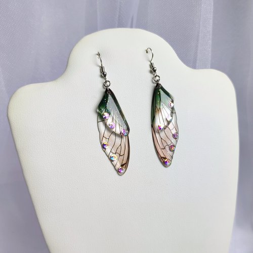 Fairy dangle earrings with clear and green resin fairy wings, glitter and diamantes. 