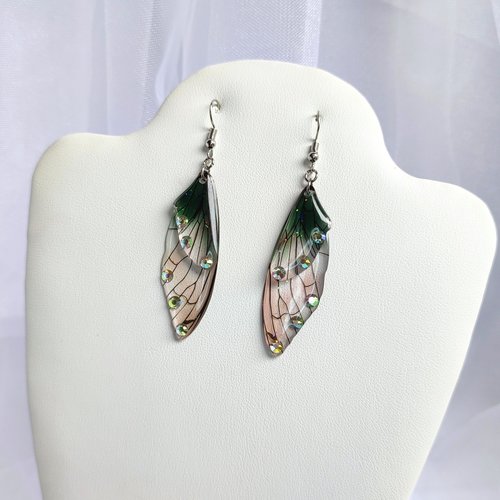 Fairy dangle earrings with clear and green resin fairy wings, glitter and diamantes. 