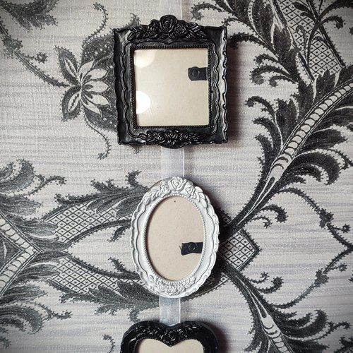 Gothic hanging photo frames in black and silver with square, oval and heart shaped frames.