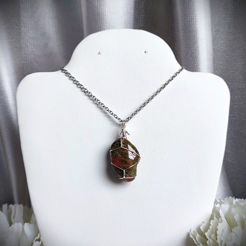 Unakite pendant wrapped in silver plated wire.