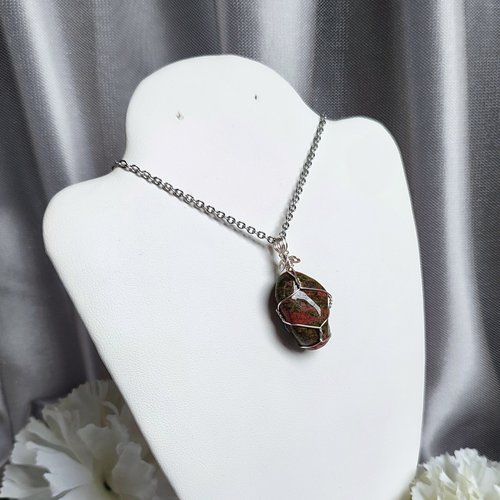 Unakite pendant wrapped in silver plated wire.