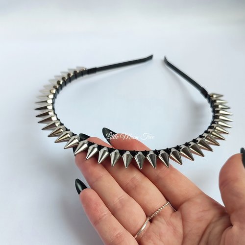 Studded headband with silver spikes wire wrapped onto a black headband.