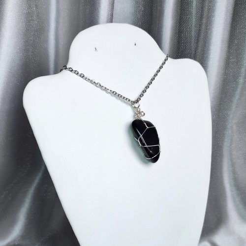 Obsidian wire wrapped pendant in silver with chain or cord.