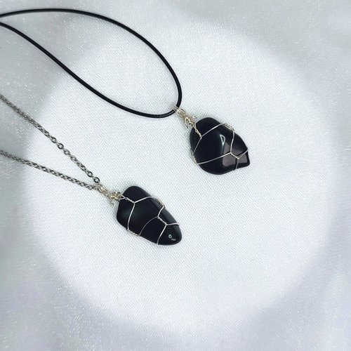 Obsidian wire wrapped pendant in silver with chain or cord.