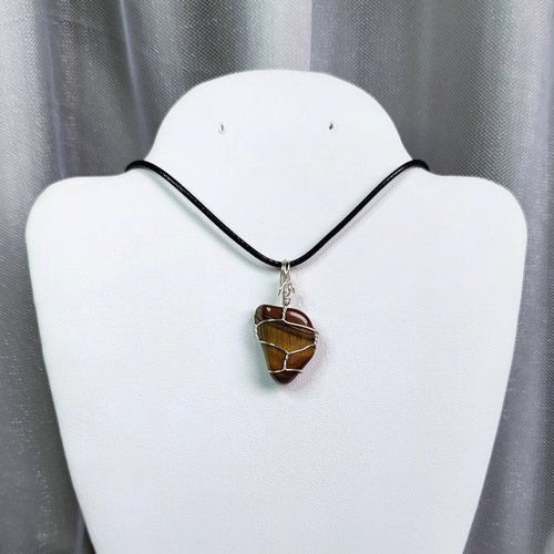 Tiger's eye wire wrapped pendant with chain or cord.