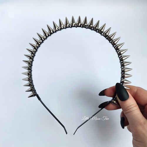 Studded headband with silver spikes wire wrapped onto a black headband.