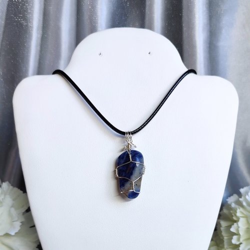 Sodalite wire wrapped pendant in silver.