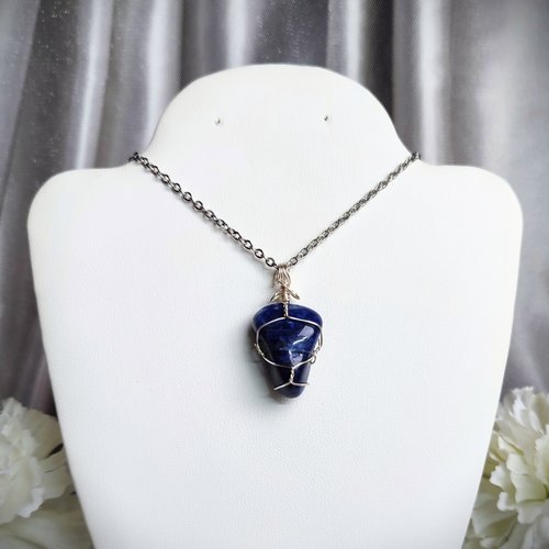 Sodalite wire wrapped pendant in silver.