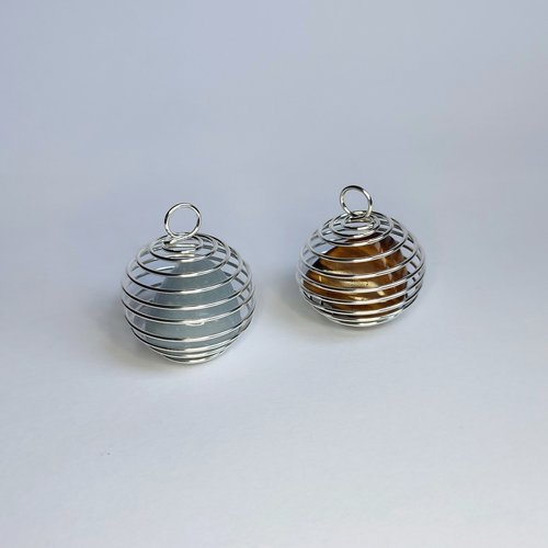 Spiral cage pendant with cord and mystery gemstones.