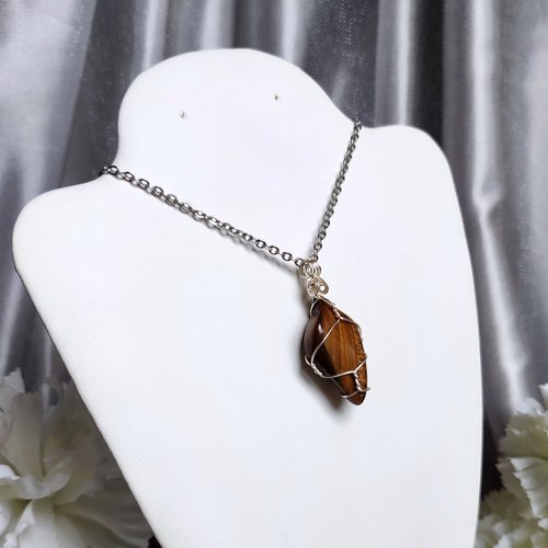 Tiger's eye wire wrapped pendant with chain or cord.