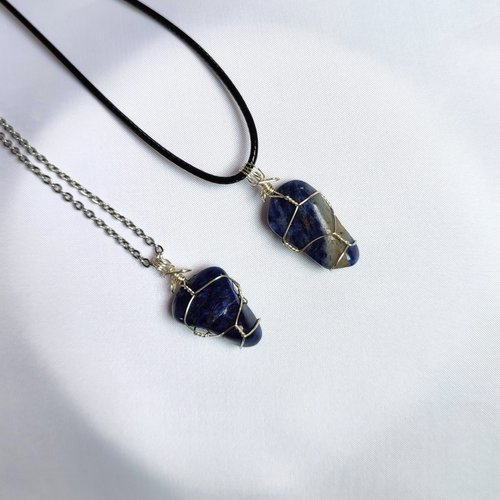 Sodalite wire wrapped pendant in silver.