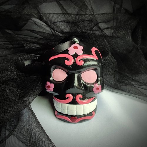 Day of the Dead pink and black sugar skull hanging ornament.