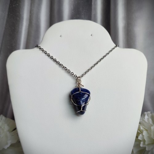 Sodalite wire wrapped pendant in silver.